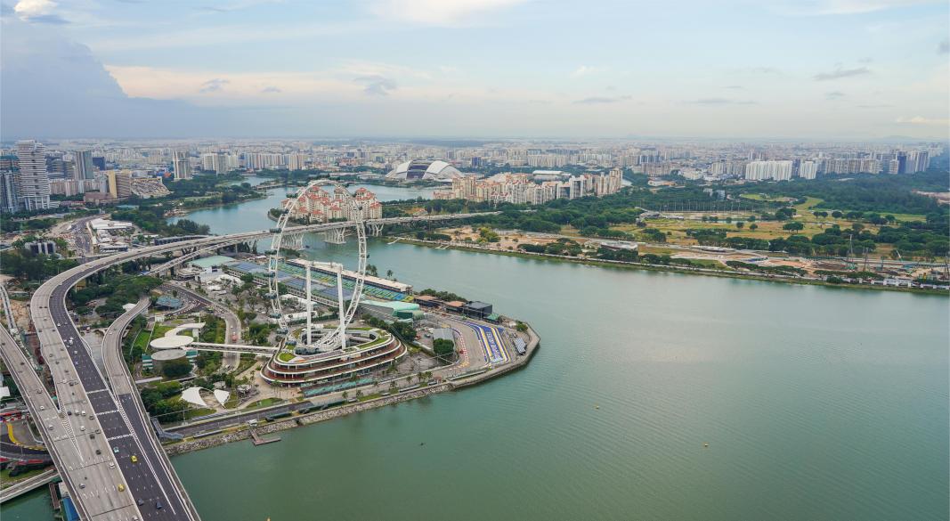 Travelers enjoying budget-friendly hawker food and walking around Marina Bay Gardens in Singapore.