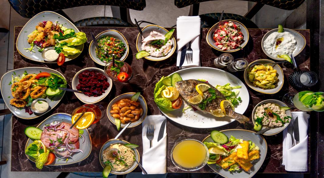 A collage of London’s famous food districts including Soho, Shoreditch, Mayfair, and Camden with iconic restaurants.