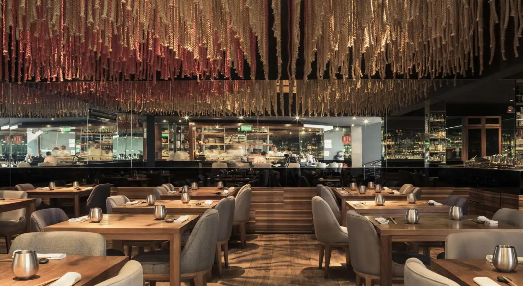 Plated dish at Maido: artistic presentation blending Peruvian and Japanese elements