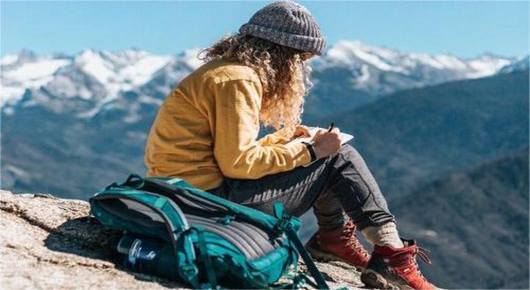 “Traveler exploring city with backpack and map”