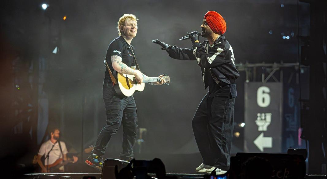 Indian and Western artists performing cross-cultural music collaboration