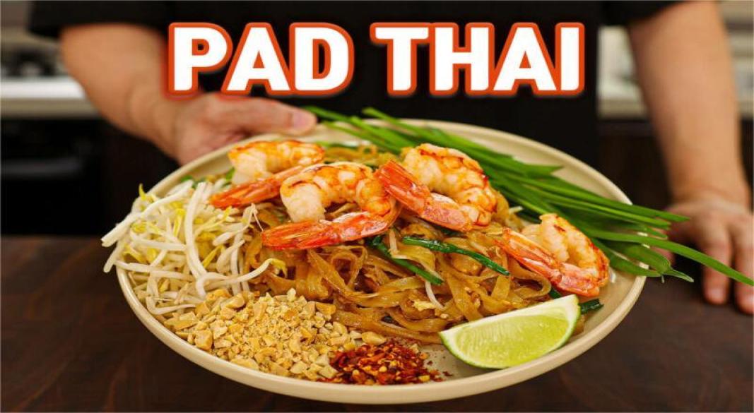 "Authentic Pad Thai street food with noodles, shrimp, tofu, and peanuts"