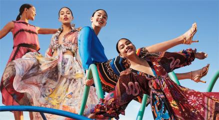 Models showcasing colorful and sustainable fashion designs on the