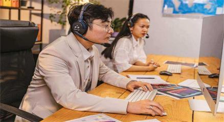 Japanese office workers and foreign employees collaborating in a modern workplace, symbolizing Japan’s job market