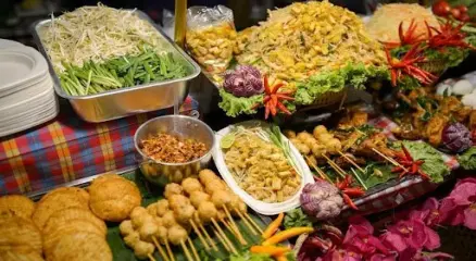 Street food vendor serving authentic Thai dishes in Bangkok