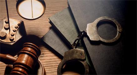 A judge’s gavel balancing on digital code background