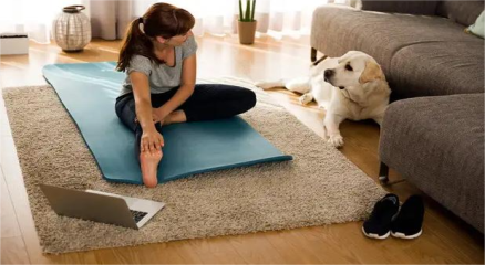 Busy professional doing a quick home workout in the living room