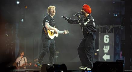 Indian and Western artists performing cross-cultural music collaboration