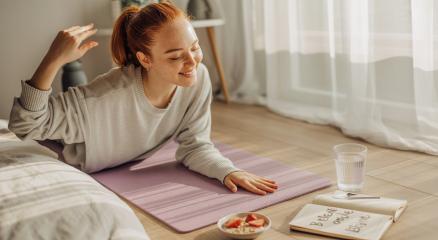 Person enjoying a peaceful morning routine with coffee and journal