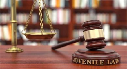 A gavel beside handcuffs symbolizing juvenile justice
